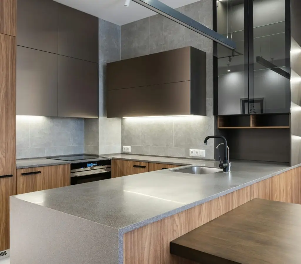 A kitchen with a counter top and a sink