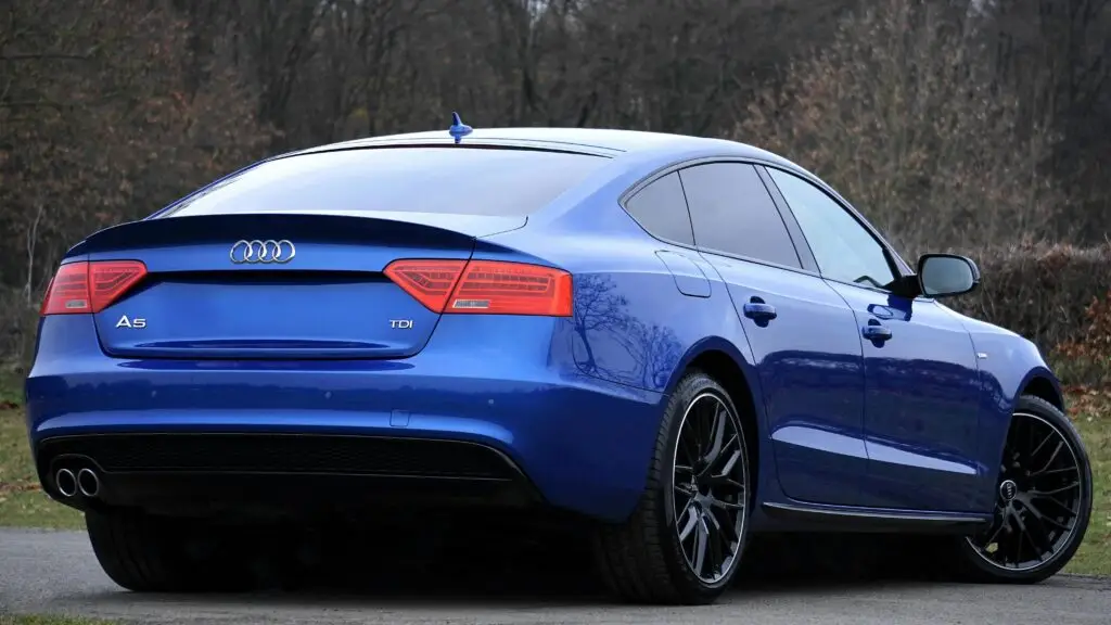 A blue car parked on the road